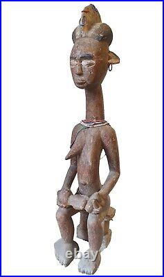 Baule Female Seated Wood maternity figure. Rare, Old And Beautiful. Ivory Coast